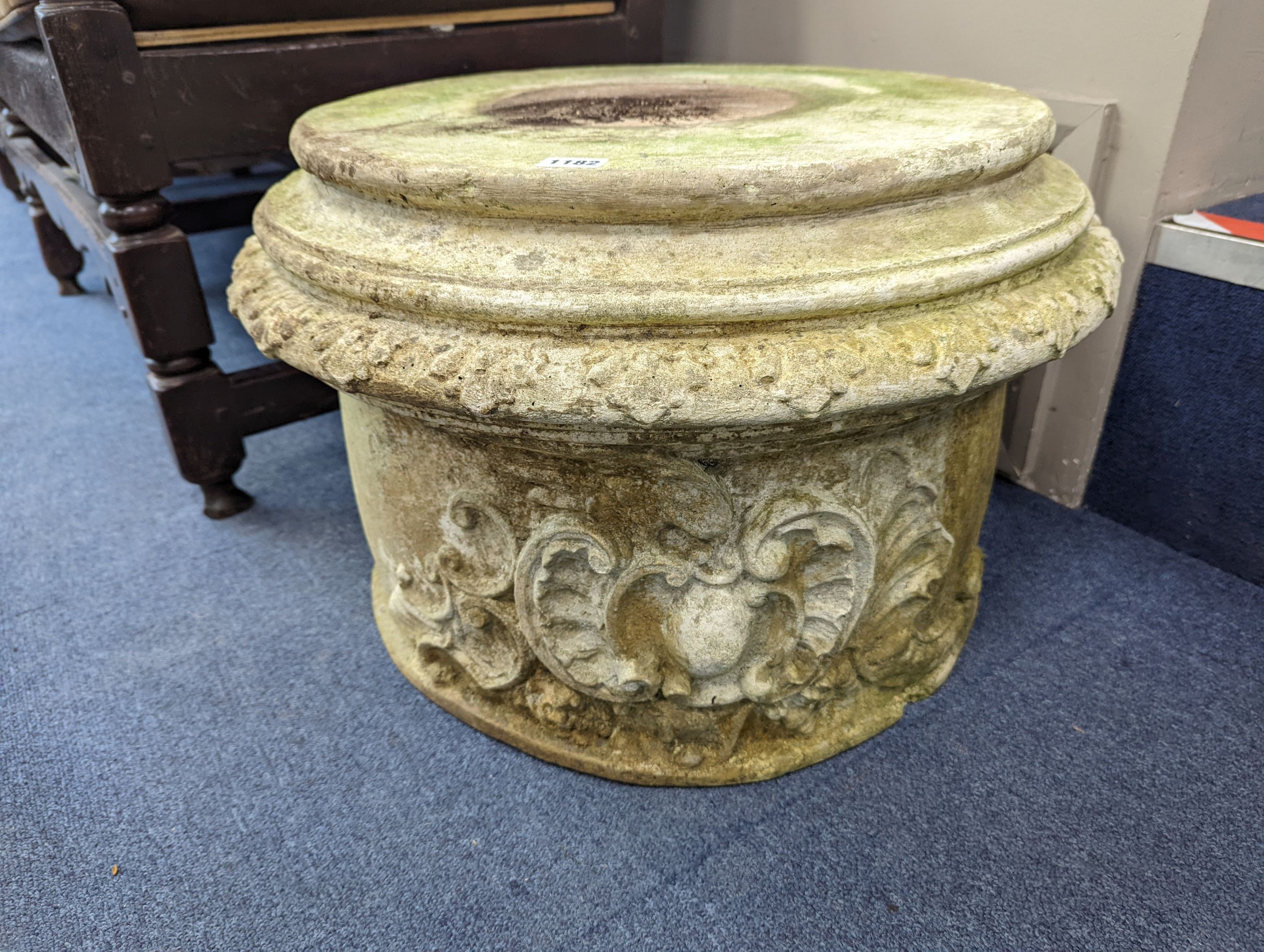 A pair of reconstituted stone circular garden plinths, diameter 60cm, height 38cm